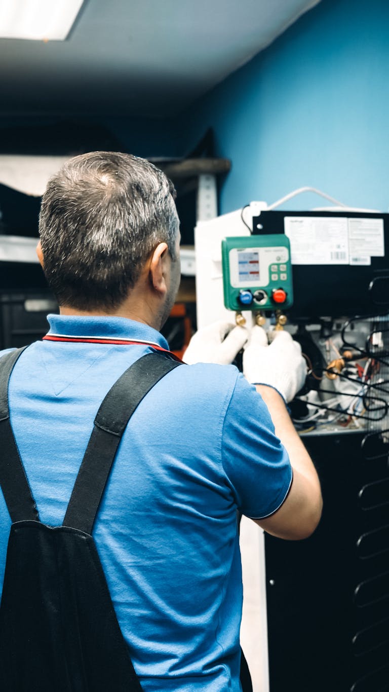 A skilled technician working on refrigeration system.