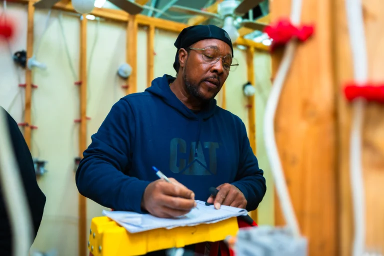 Trade school student taking notes during electrical training class in Las Vegas
